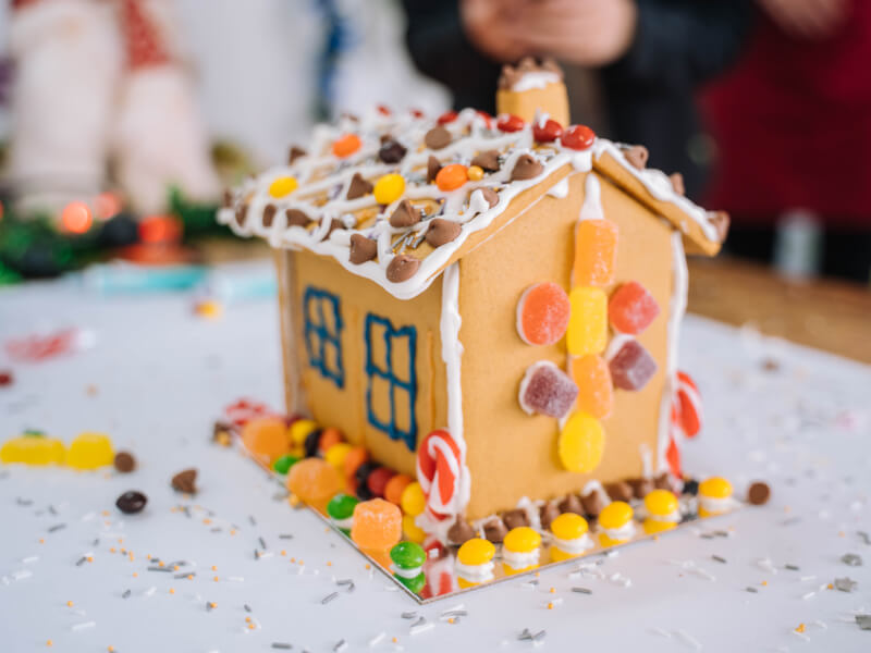 A DIY gingerbread house decorated with sweets